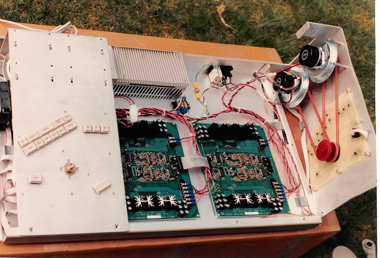 Power supply, motor driver boards and two motors connected by belts to knobs