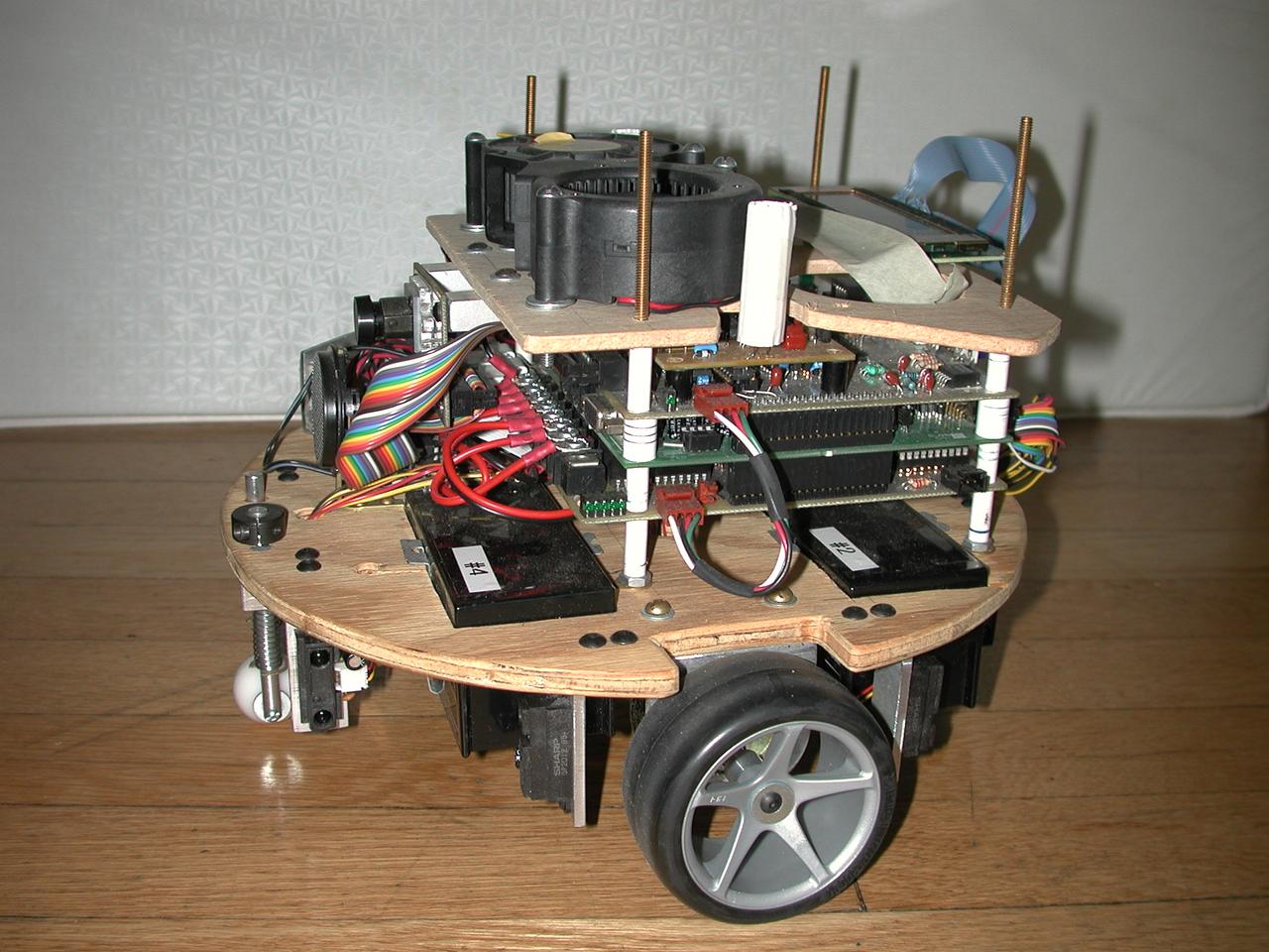 Second entry - blowers for extinguishing flame, IR range sensors, wheels directly driven by gear motors with encoders, custom printed circuit boards, sonar and video for flame detection